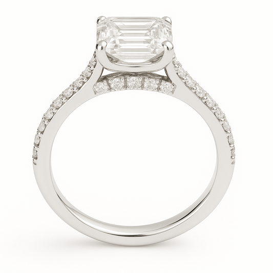 Elegant Moissanite emerald-cut engagement ring in white-gold-plated 925 silver, featuring a 7×5 mm center with pavé band for brilliance. Now at BSI Jewelry.