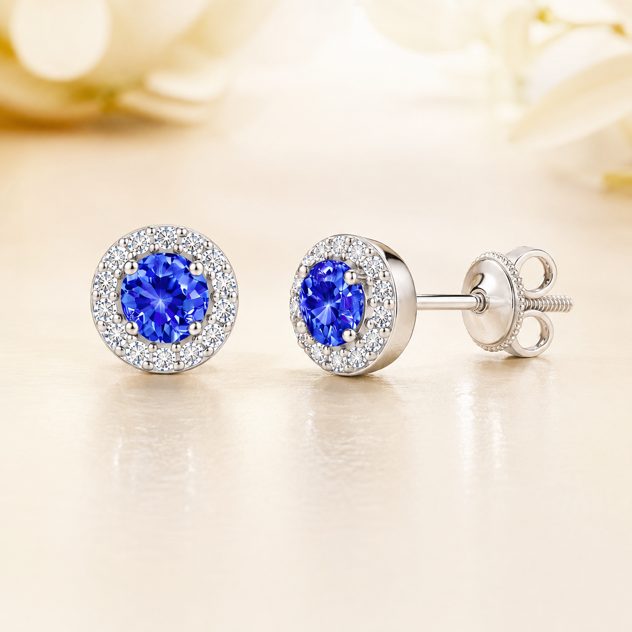 Blue sapphire stud earrings with 4 mm round cut in white gold-plated 925 silver, accented with moissanite and screw-back posts. Available now at BSI Jewelry.