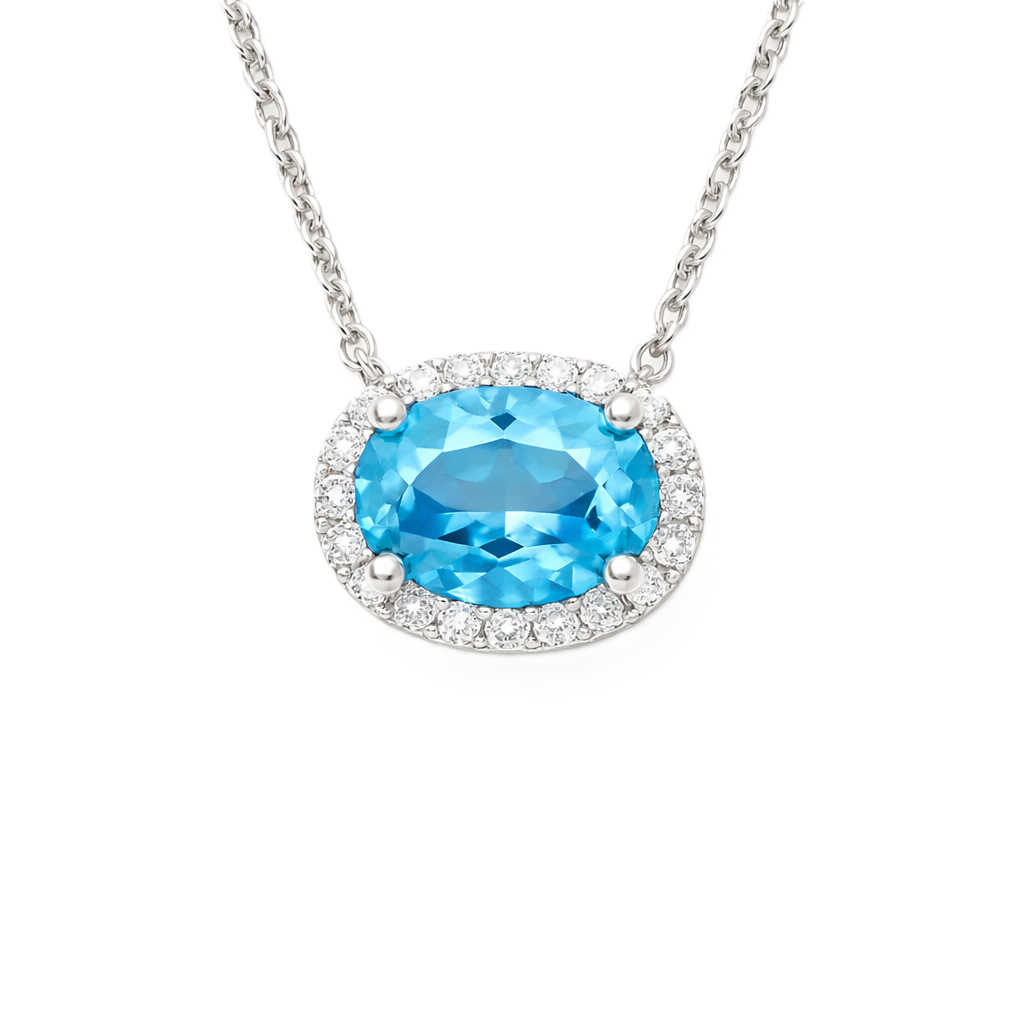 Elegant Oval Blue Topaz Necklace featuring a 9x7 mm gemstone with round brilliant Moissanite in white gold plated 925 silver. Hypoallergenic. Shop BSI Jewelry.