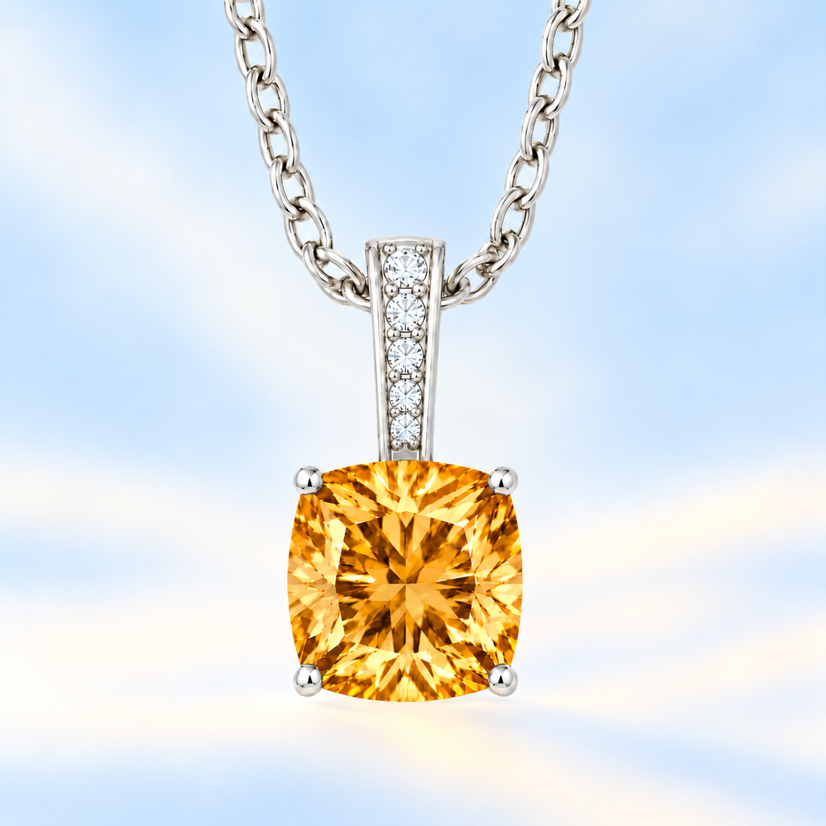 Citrine cushion pendant in white gold-plated 925 silver with moissanite accents. Elegant and hypoallergenic. Available now at BSI Jewelry.