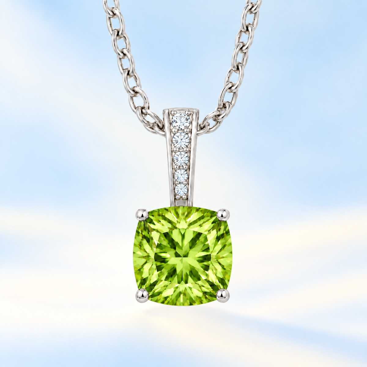 Peridot cushion pendant in white gold-plated 925 silver with moissanite accents. Elegant and hypoallergenic. Available now at BSI Jewelry.