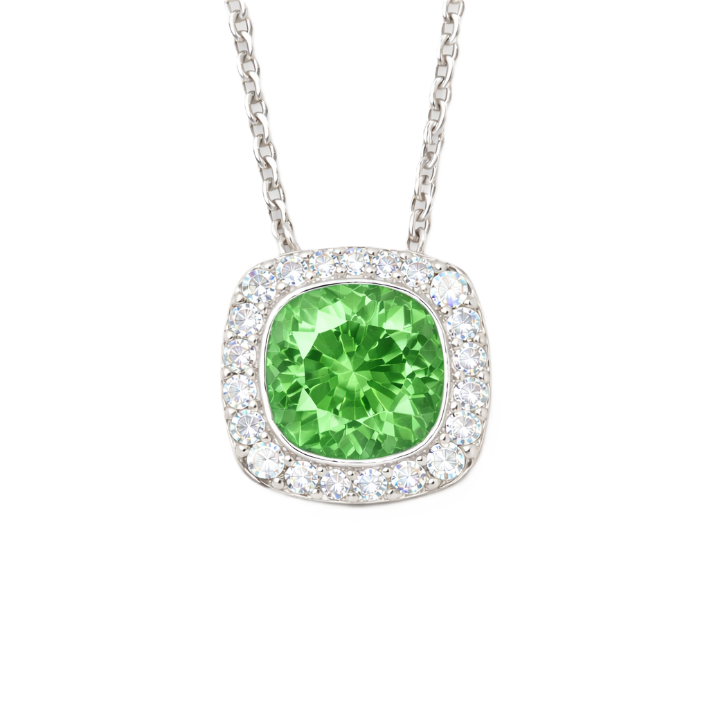 Green sapphire cushion pendant with 6 mm center stone in white gold-plated 925 silver, accented with moissanite. Elegant and refreshing. Available at BSI Jewelry.