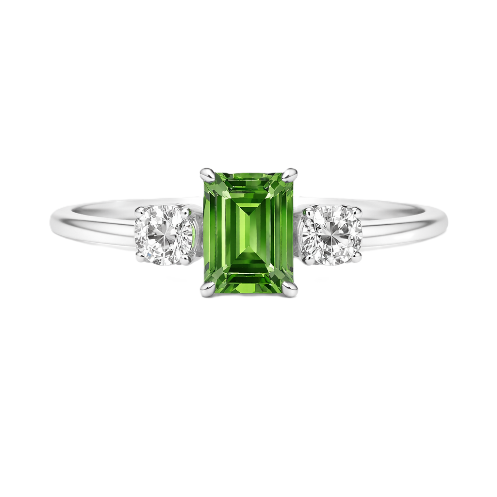 Green sapphire ring, 6×4 mm emerald cut with 3 mm moissanite sides, set in white gold-plated 925 silver. Elegant and hypoallergenic. Available now at BSI Jewelry.