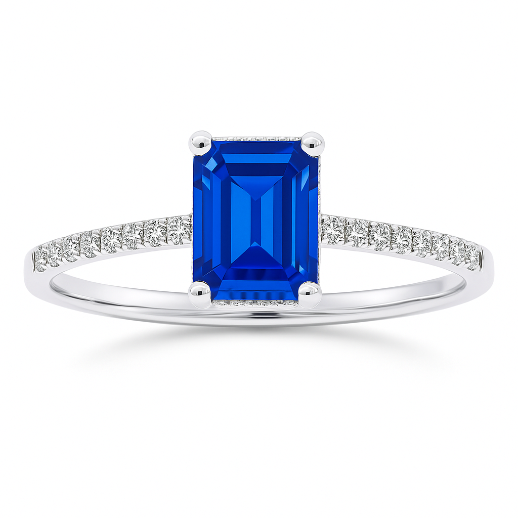 Emerald-cut 7×5 mm blue sapphire ring with Moissanite on white gold-plated 925 silver. Elegant, brilliant, and hypoallergenic. Available now at BSI Jewelry.