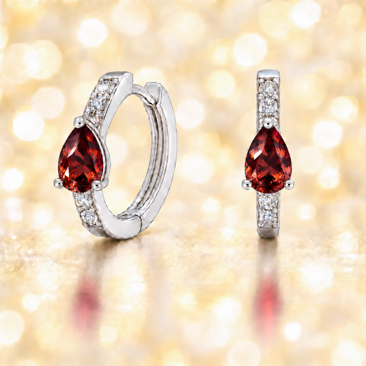 Elegant pear-cut Garnet huggie in white gold-plated 925 silver with Moissanite accents for fresh, versatile sparkle. Available now at BSI Jewelry.
