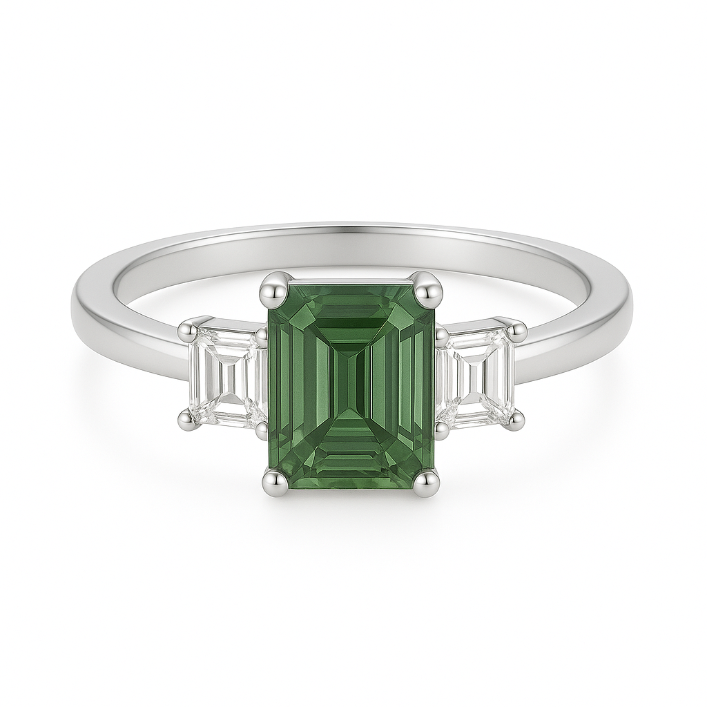 7×5 mm emerald-cut green sapphire ring with baguette Moissanite accents in white-gold-plated 925 silver. Beauty and graceful charm. Available now at BSI Jewelry.