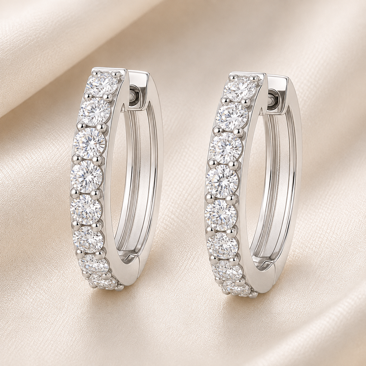 1.5 mm round Moissanite huggies in white gold-plated 925 silver. Fine sparkle, lightweight, hypoallergenic and safe for daily wear. Available now at BSI Jewelry.