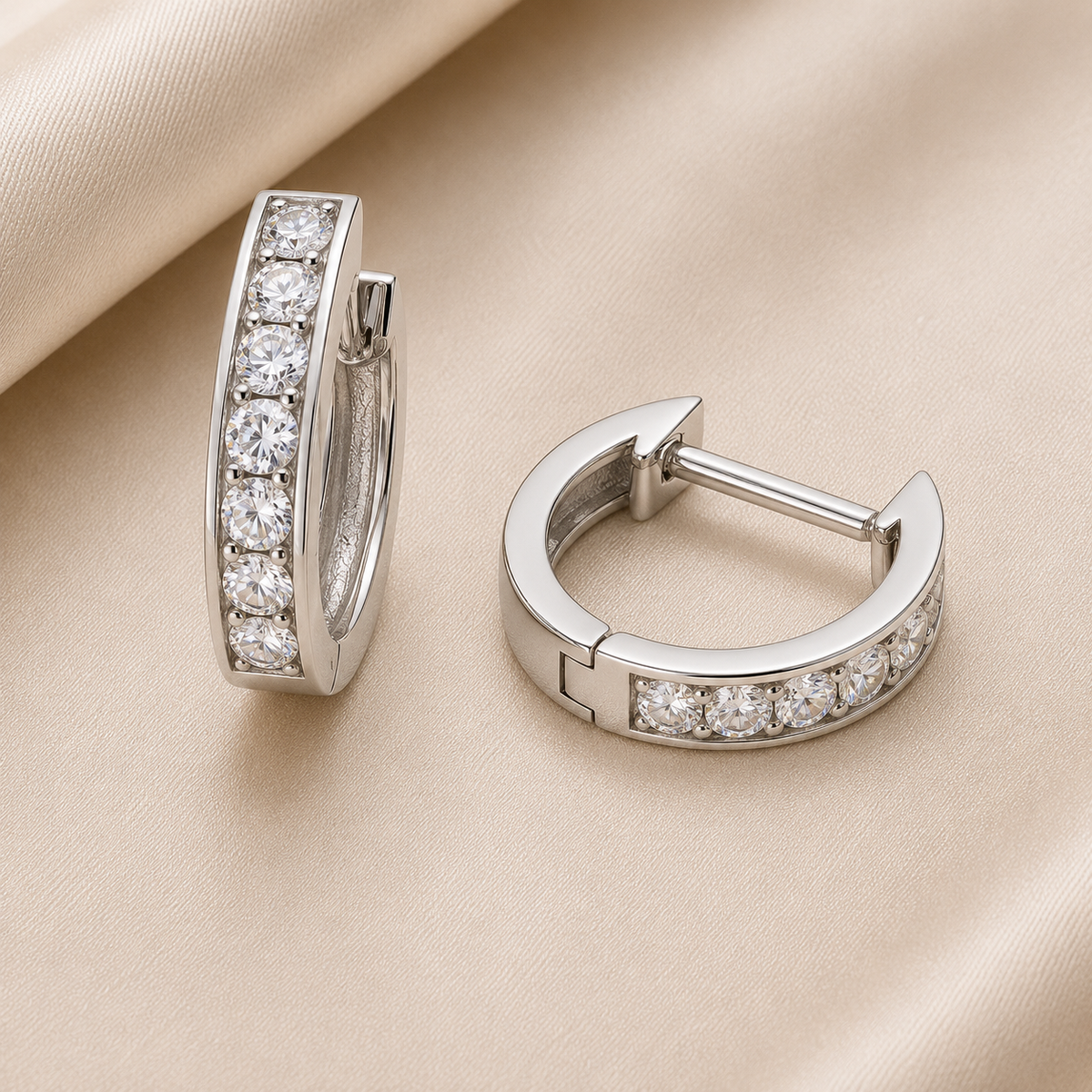 2.5 mm moissanite pave set huggies earrings in white gold-plated 925 silver. Sleek, refined and hypoallergenic for daily wear. Available now at BSI Jewelry.