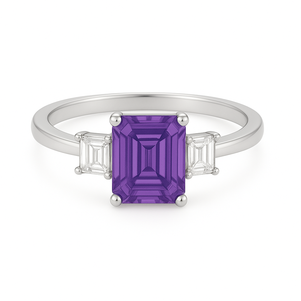 7×5 mm emerald-cut purple sapphire ring with baguette Moissanite accents in white-gold-plated 925 silver. Romantic brilliance. Available now at BSI Jewelry.