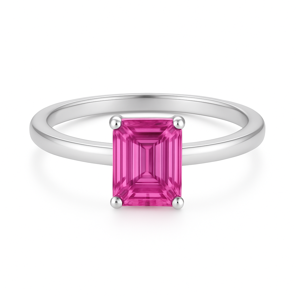 7×5 mm emerald-cut pink sapphire solitaire ring set in white-gold-plated 925 silver. Radiant hue, timeless elegance, and refined simplicity. Now at BSI Jewelry.