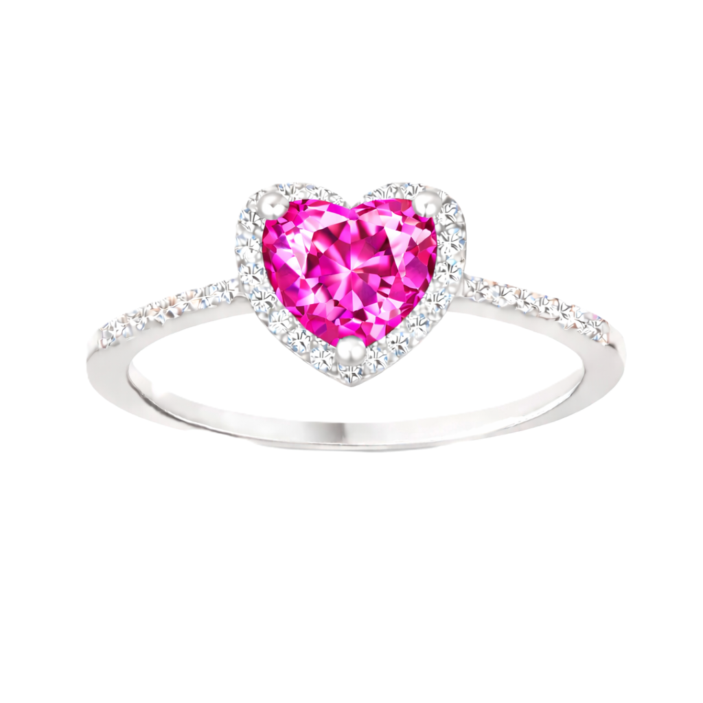 Pink sapphire ring with a 6 mm heart cut, accented by moissanite in white gold-plated 925 silver. Elegant and timeless. Available now at BSI Jewelry.