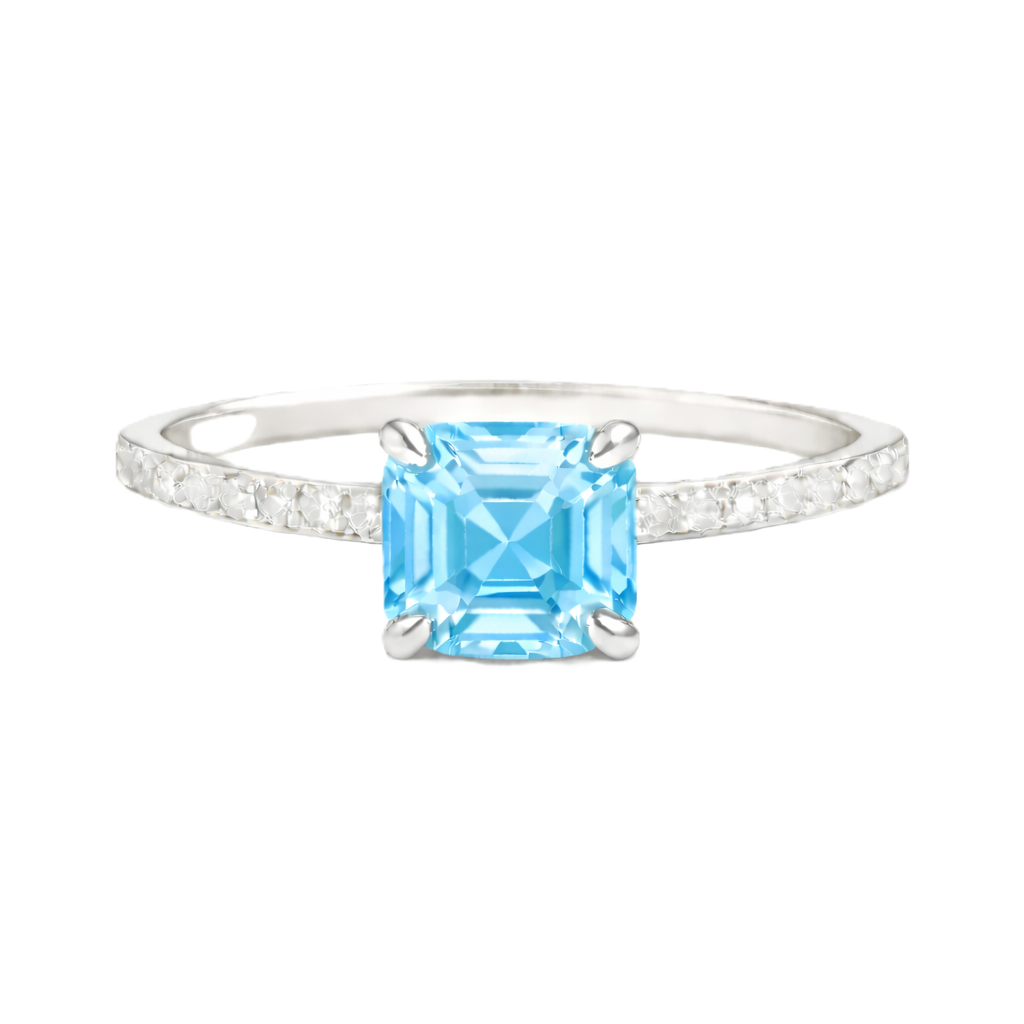 Sky blue topaz ring with a 6 mm Asscher-cut in white gold-plated 925 silver, accented with moissanite and fresh blue brilliance. Available now at BSI Jewelry.