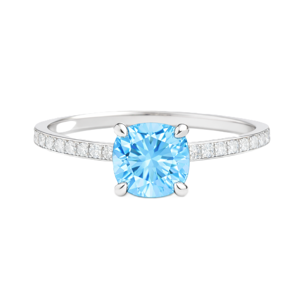 Sky blue topaz ring with a 6 mm cushion in white gold-plated 925 silver, accented with moissanite. Fresh and elegant for daily wear. Available now at BSI Jewelry.