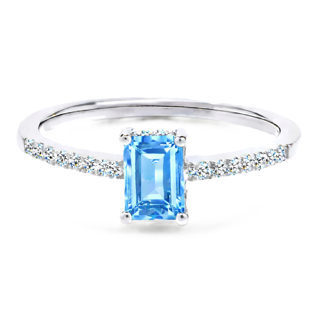 Sky blue topaz ring with a 7×5 mm emerald cut in white gold-plated 925 silver, with moissanite. Elegant and refined for daily wear. Available now at BSI Jewelry.