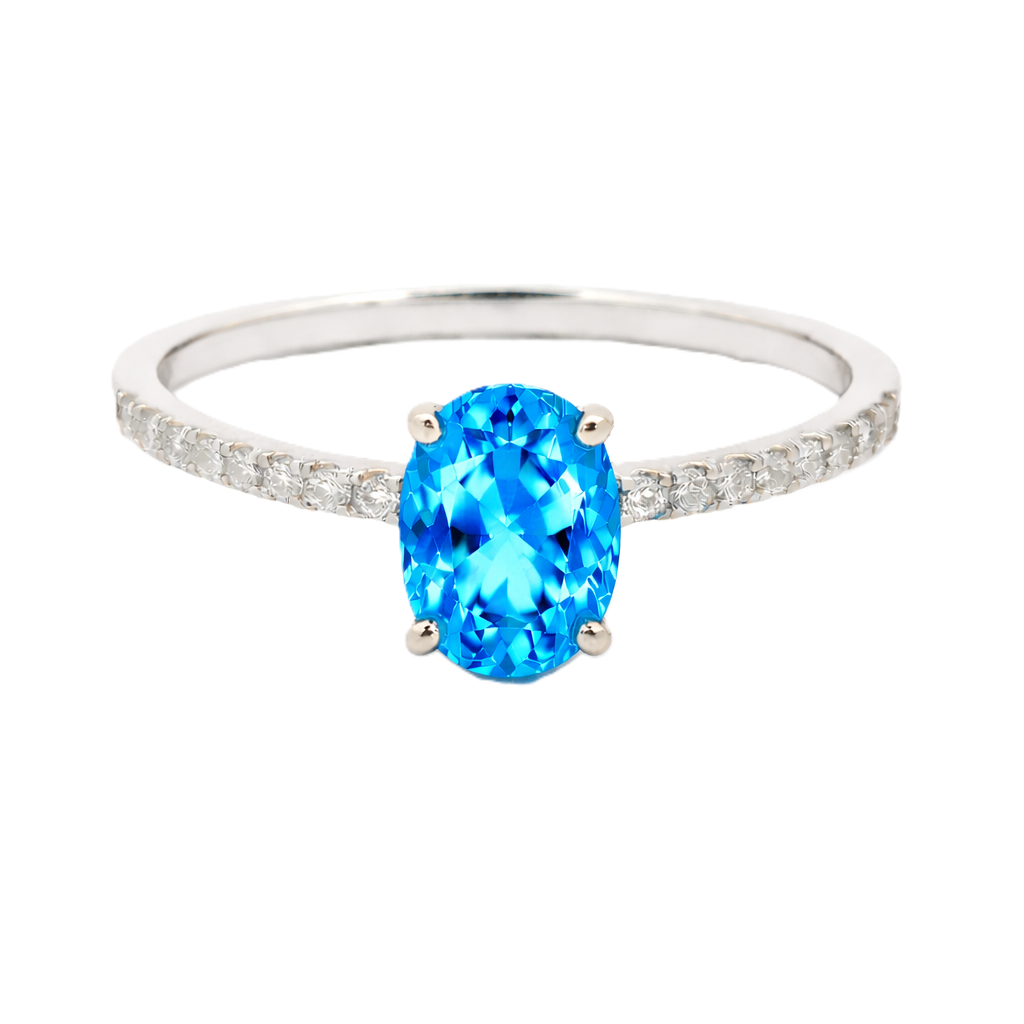 Swiss blue topaz ring with a 7×5 mm oval-cut stone and moissanite accents in white gold plated 925 silver. Elegant for daily wear. Available now at BSI Jewelry.