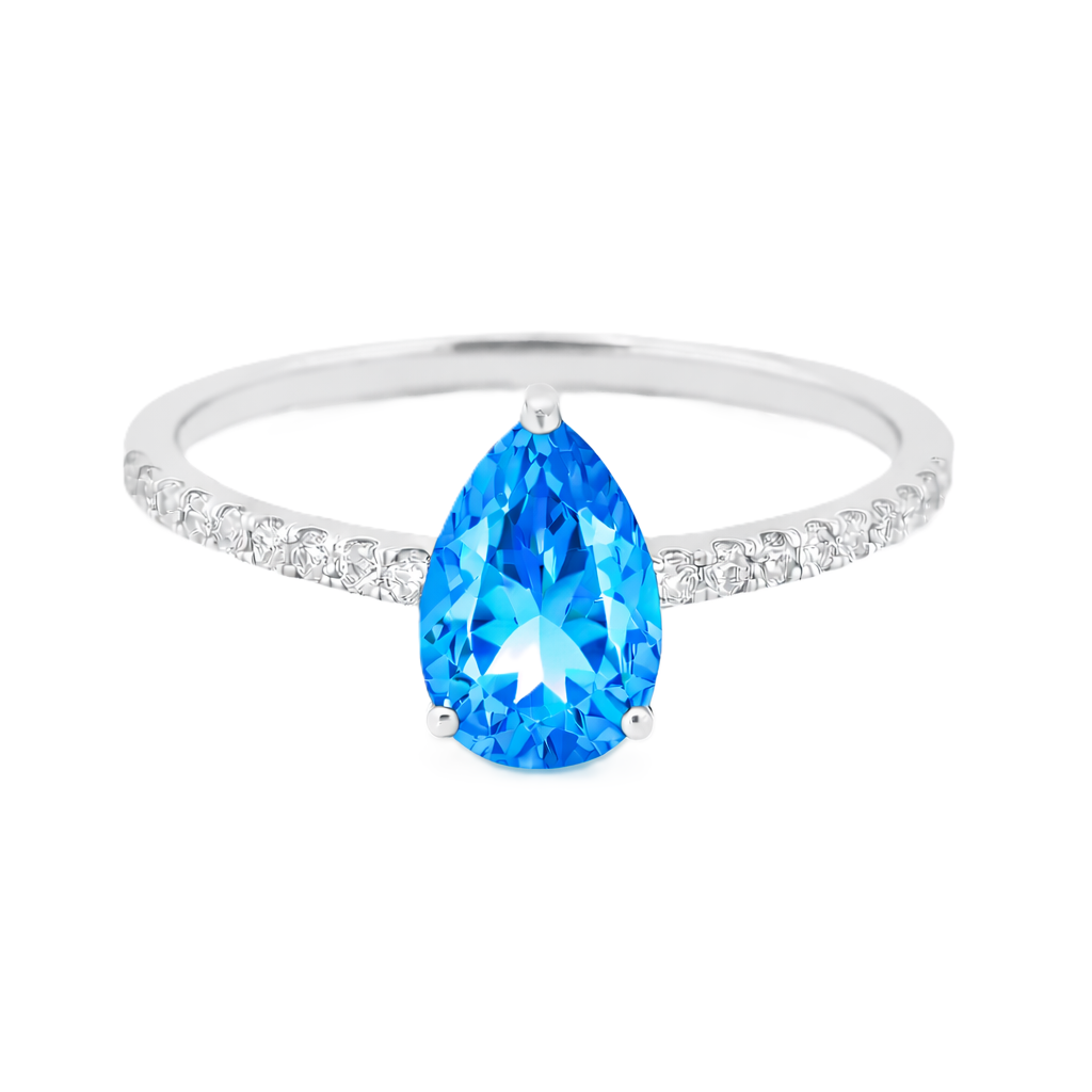 Swiss blue topaz ring with a 7×5 mm pear-cut stone and moissanite accents in white gold plated 925 silver. Elegant for daily wear. Available now at BSI Jewelry.