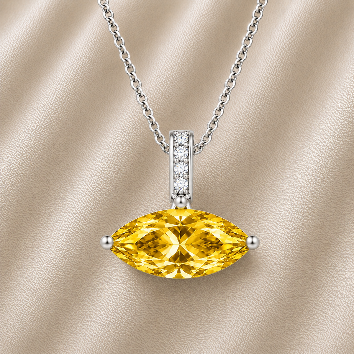 Yellow sapphire marquise pendant with an 8×5 mm gemstone in white gold-plated 925 silver with moissanite accents. Elegant and refined. Available now at BSI Jewelry.