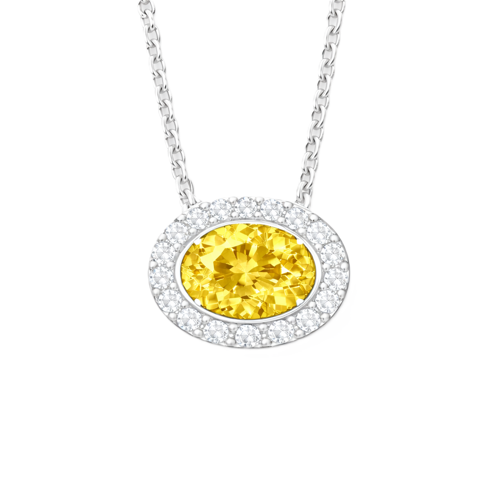 Yellow sapphire pendant with a 7×5 mm oval stone in white gold-plated 925 silver, accented with moissanite. Warm and elegant. Available now at BSI Jewelry.