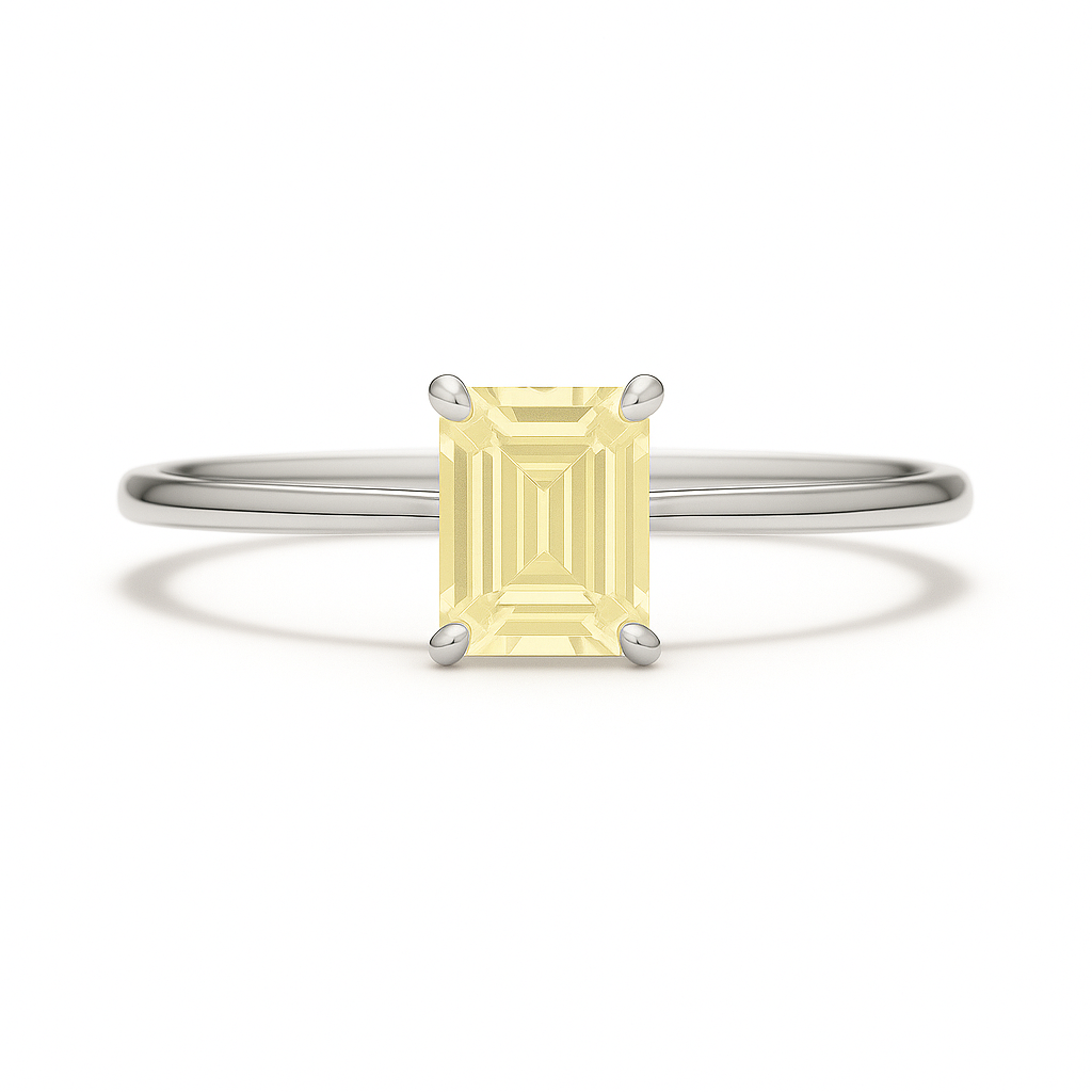 Elegant 6×4 mm emerald-cut yellow sapphire ring crafted in white gold-plated 925 silver with palladium alloy. Timeless brilliance. Available now at BSI Jewelry.