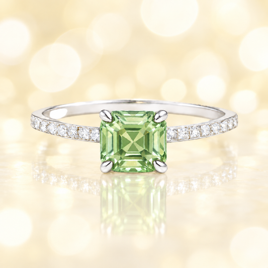 Prasiolite ring with a 6 mm Asscher-cut stone in white gold-plated 925 silver, accented with moissanite and soft green brilliance. Available now at BSI Jewelry.