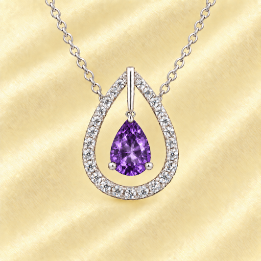 Amethyst necklace with a 7×5 mm pear-cut in white gold-plated 925 silver, accented by a moissanite halo. Elegant and refined. Available now at BSI Jewelry.