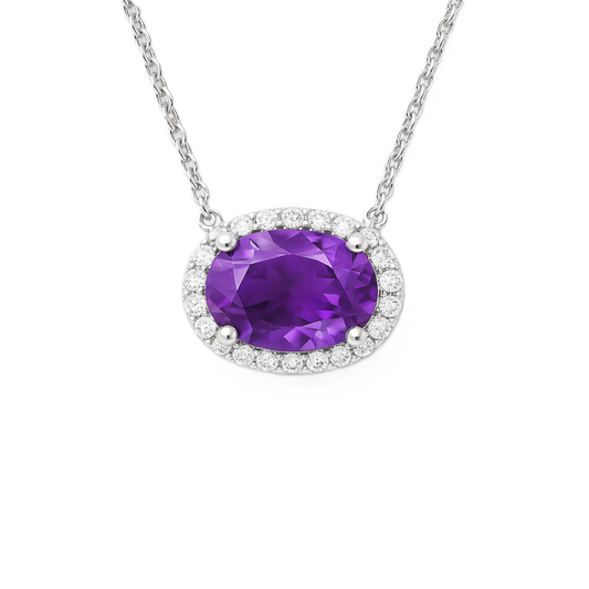 Moissanite and amethyst necklace with 9×7 mm oval gemstone in white gold-plated 925 silver with moissanite. Rich and elegant. Available now at BSI Jewelry.
