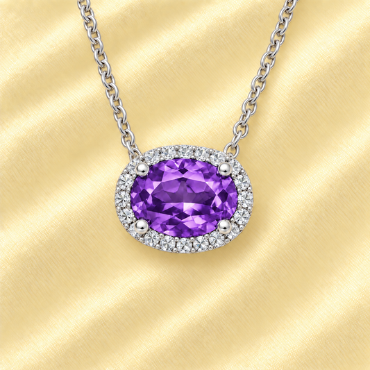 Moissanite and amethyst necklace with 9×7 mm oval gemstone in white gold-plated 925 silver with moissanite. Rich and elegant. Available now at BSI Jewelry.