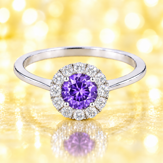 Amethyst ring with a 4.50 mm round-cut in white gold-plated 925 silver, accented with moissanite for elegant purple brilliance. Available now at BSI Jewelry.