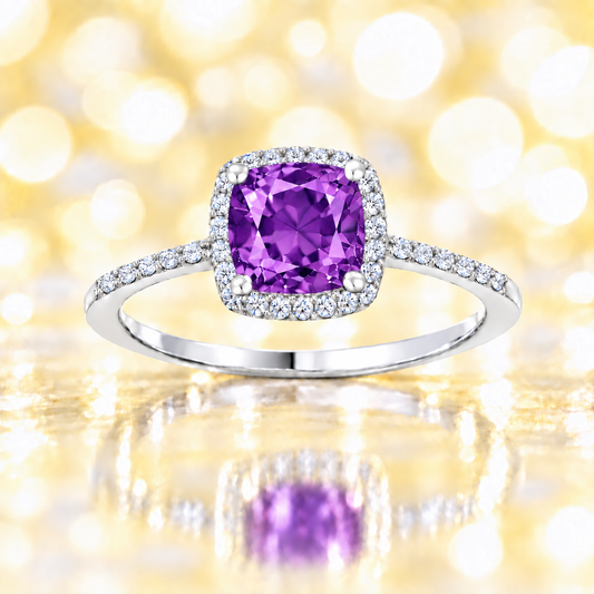 Amethyst ring with a 6 mm cushion-cut center in white gold-plated 925 silver, accented with moissanite for elegant sparkle. Available now at BSI Jewelry.