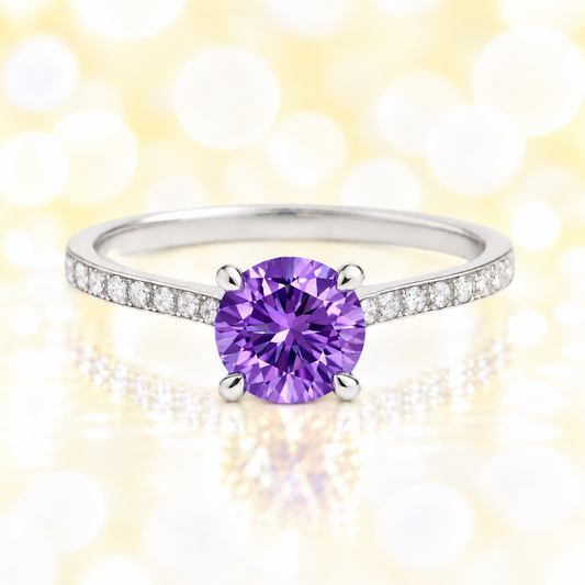Amethyst ring with a 6 mm round-cut and moissanite accents, crafted in white gold-plated 925 silver. Elegant for daily wear. Available now at BSI Jewelry.