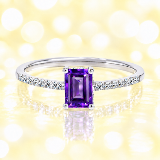 Amethyst ring with a 7×5 mm emerald cut in white gold-plated 925 silver, with moissanite. Elegant and refined for daily wear. Available now at BSI Jewelry.