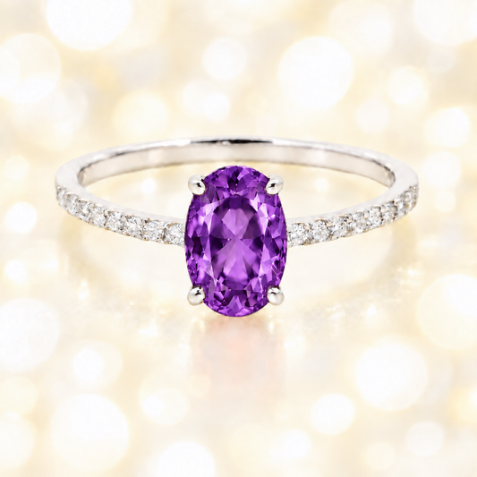 Amethyst ring with a 7×5 mm oval-cut stone and moissanite accents in white gold plated 925 silver. Elegant for daily wear. Available now at BSI Jewelry.