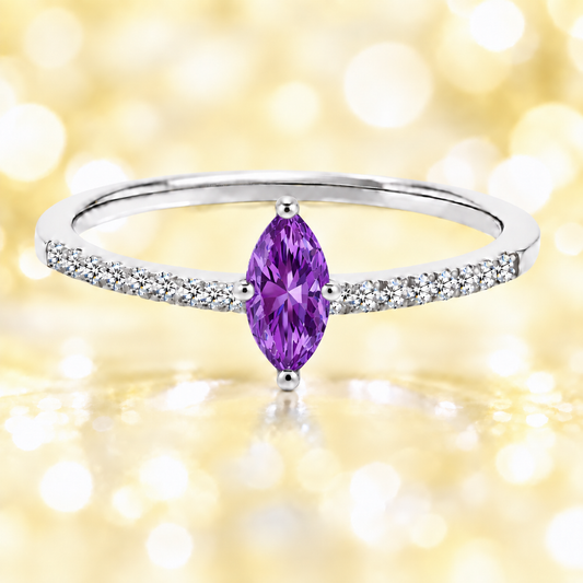 Amethyst ring with an 8×4 mm marquise-cut stone, accented by moissanite in white gold-plated 925 silver. Elegant and timeless. Available now at BSI Jewelry.