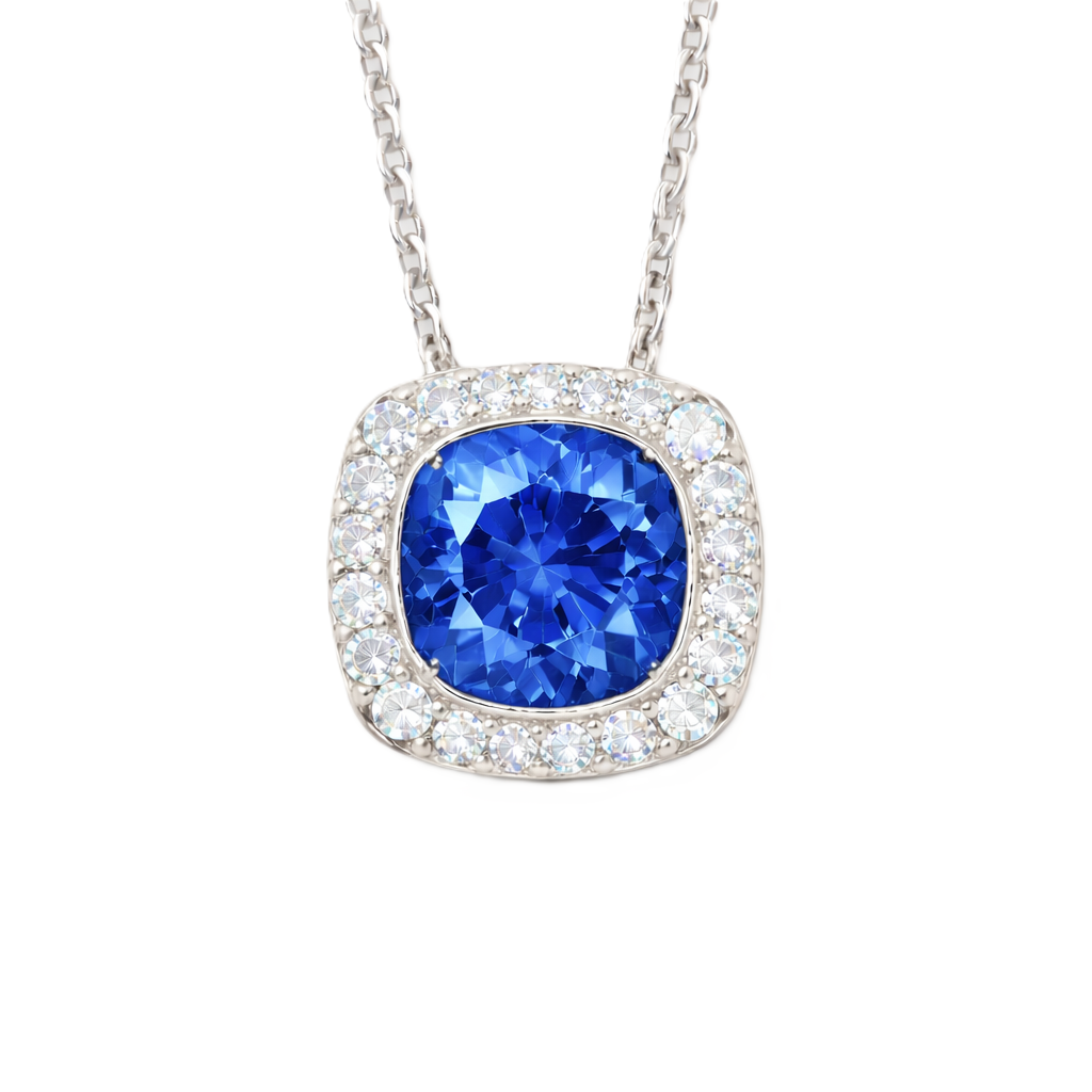 Blue sapphire cushion pendant with 6 mm center stone in white gold-plated 925 silver, accented with moissanite. Elegant and timeless. Available now at BSI Jewelry.