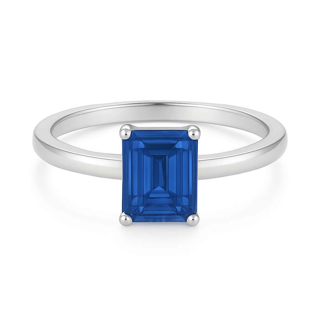7×5 mm emerald-cut blue sapphire solitaire ring set in white-gold-plated 925 silver. Radiant color, refined simplicity, and timeless elegance. Now at BSI Jewelry.
