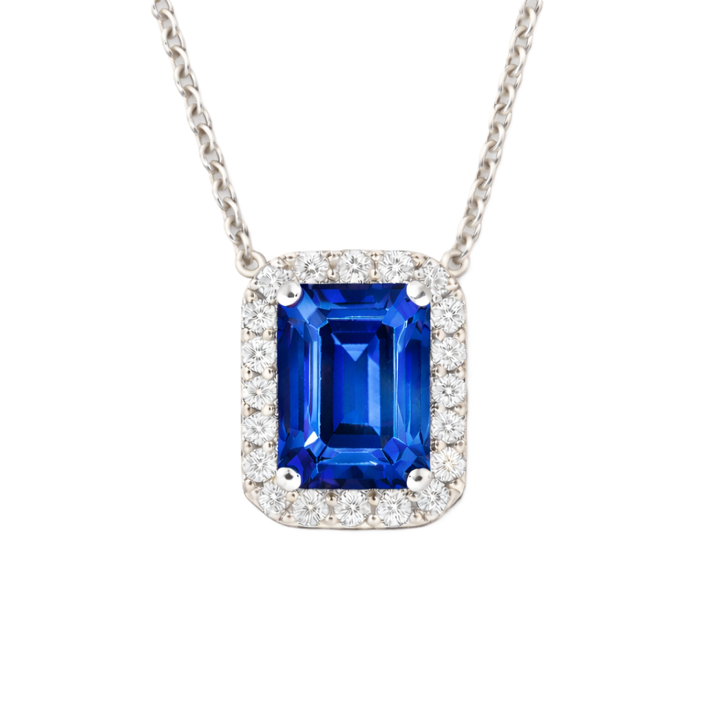 Blue sapphire emerald cut necklace with 7×5 mm center stone in white gold-plated 925 silver. Timeless and elegant for everyday wear. Available now at BSI Jewelry.