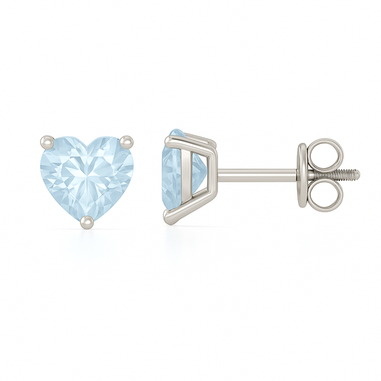 Elegant 6mm heart-cut Blue Sapphire stud earrings in white-gold-plated 925 silver, hypoallergenic and safe to wear. Available now at BSI Jewelry.