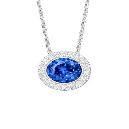 Blue sapphire necklace with a 7×5 mm oval stone in white gold-plated 925 silver, accented with moissanite. Elegant and timeless. Available now at BSI Jewelry.