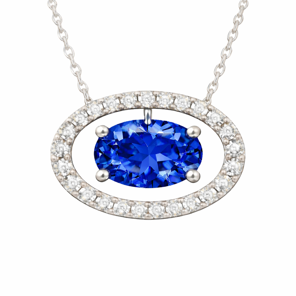 Blue sapphire necklace with an 8×5 mm oval cut and moissanite halo, crafted in white gold-plated 925 silver. Elegant and refined. Available now at BSI Jewelry.