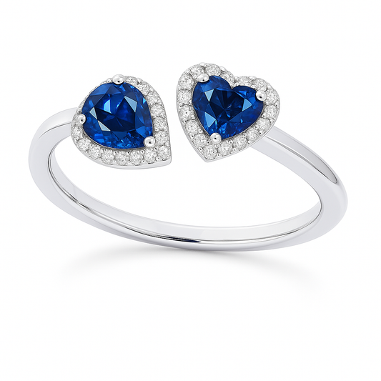 Blue sapphire open ring with 5 mm heart and 5×3 mm pear stones, halo set in white gold plated 925 silver. Elegant and modern. Available now at BSI Jewelry.