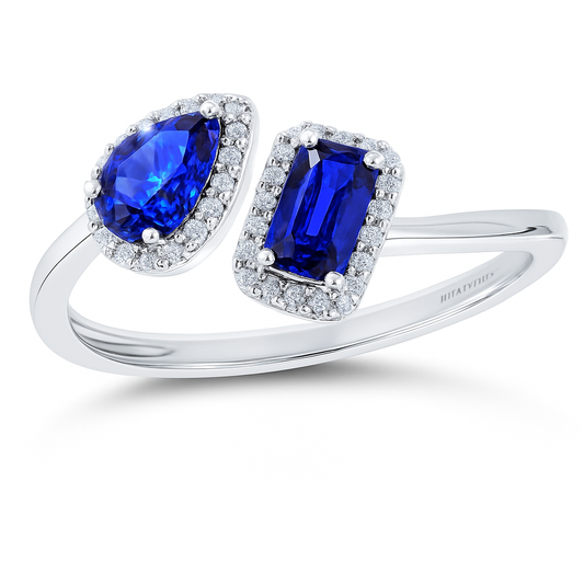 Blue sapphire open ring with 5×3 mm pear and emerald stones in white gold plated 925 silver. Elegant and modern design. Available now at BSI Jewelry.