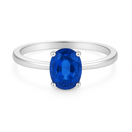 Elegant 7×5 mm blue sapphire oval solitaire ring in white-gold-plated 925 silver. Timeless brilliance and radiant color. Available now at BSI Jewelry.