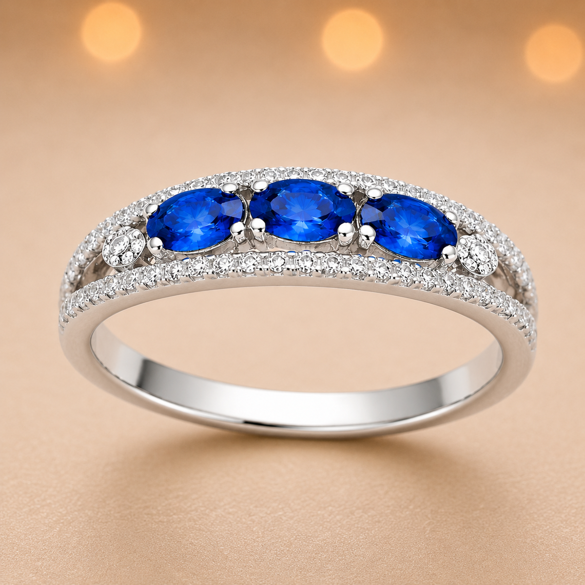 Blue sapphire ring with 5×3 mm oval stones in white gold-plated 925 silver. Classic, elegant, and hypoallergenic. Available now at BSI Jewelry.