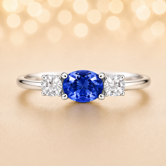 Blue sapphire ring, 5×4 mm oval with moissanite accents in white gold-plated 925 silver. Elegant and hypoallergenic. Available now at BSI Jewelry.
