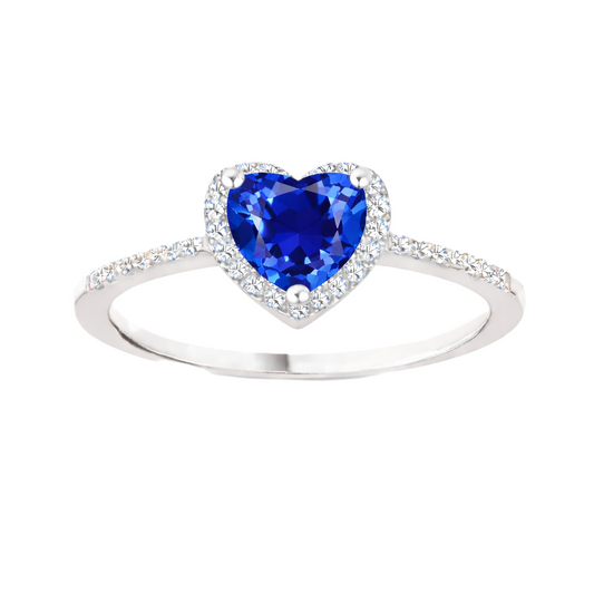 Blue sapphire ring with a 6 mm heart cut, accented by moissanite in white gold-plated 925 silver. Elegant and timeless. Available now at BSI Jewelry.