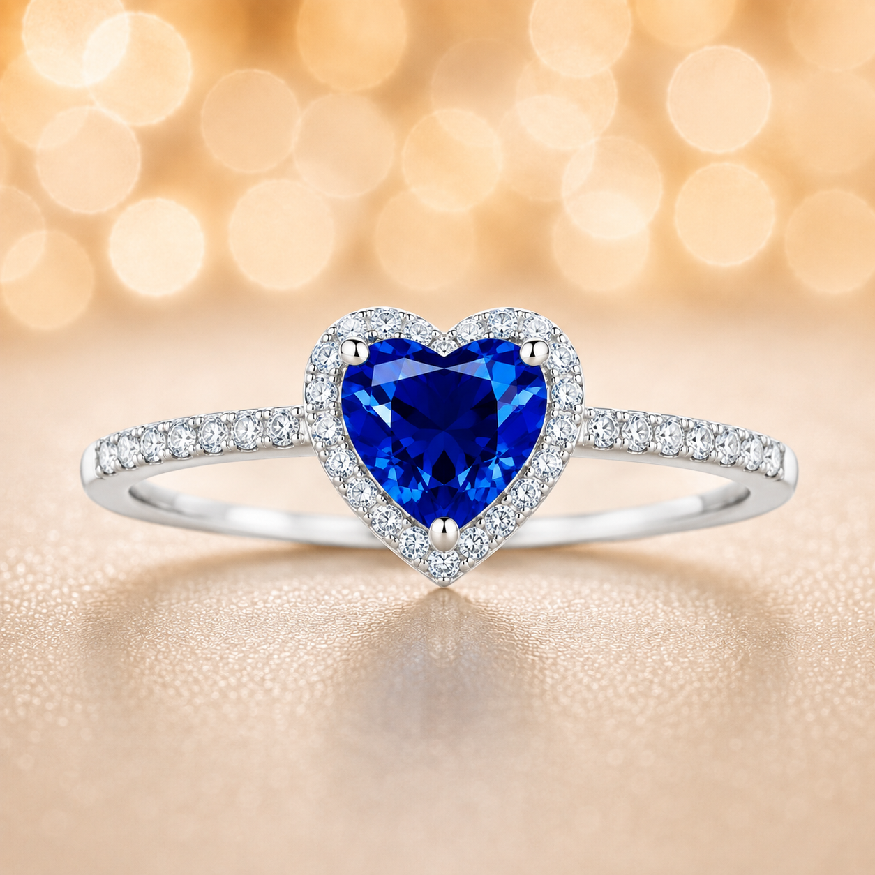 Blue sapphire ring with a 6 mm heart cut, accented by moissanite in white gold-plated 925 silver. Elegant and timeless. Available now at BSI Jewelry.