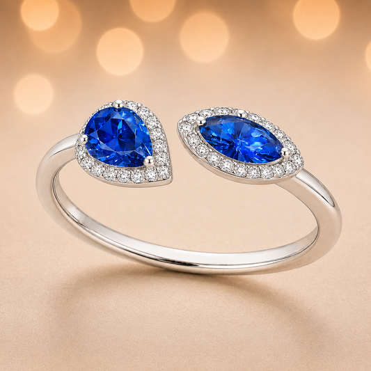 Blue sapphire ring with 6×3 mm pear and marquise cuts, crafted in white gold-plated 925 silver with moissanite accents. Available now at BSI Jewelry.