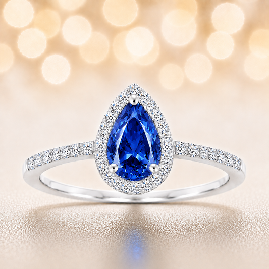 Blue sapphire ring with a 7×5 mm pear cut, with moissanite in white gold-plated 925 silver. Elegant and timeless for daily wear. Available now at BSI Jewelry.