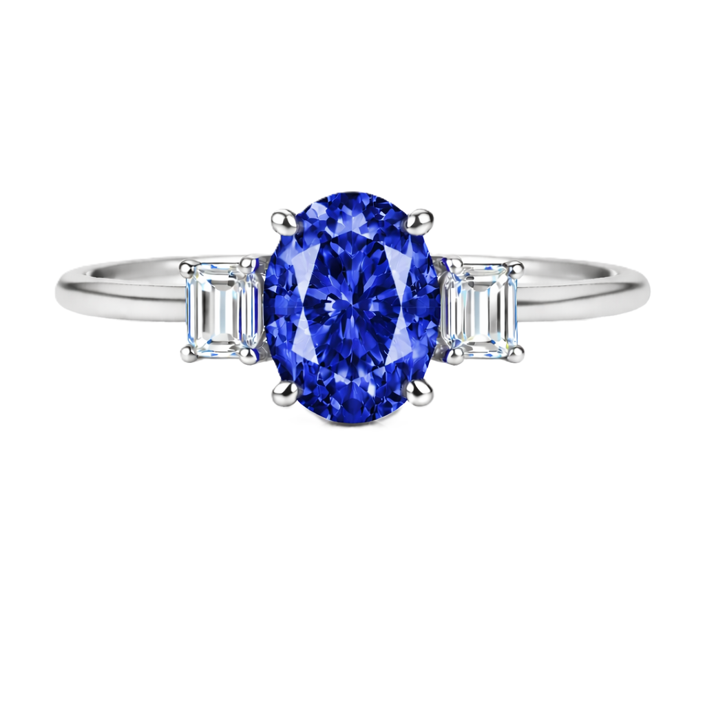 Blue sapphire ring with 7×5 mm oval center and 5×3 mm moissanite sides in white gold-plated 925 silver. Elegant and refined. Available now at BSI Jewelry.