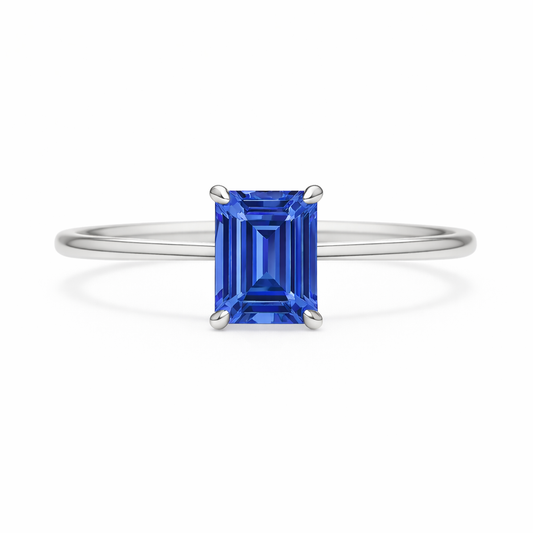 Elegant 6×4 mm emerald-cut blue sapphire ring crafted in white gold-plated 925 silver with palladium alloy. Timeless brilliance. Available now at BSI Jewelry.